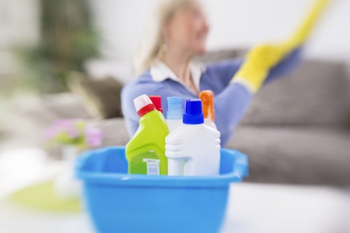 Professional carpet cleaner operating machinery with safety precautions